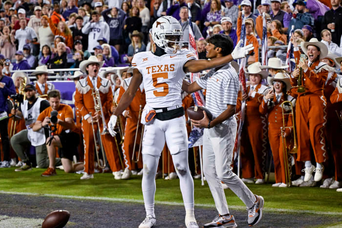 Nov 11, 2023; Fort Worth, Texas, USA; Texas Longhorns wide receiver Adonai Mitchell (5) celebrates after he scores a touchdown against the TCU Horned Frogs during the first half at Amon G. Carter Stadium. Mandatory Credit: Jerome Miron-USA TODAY Sports